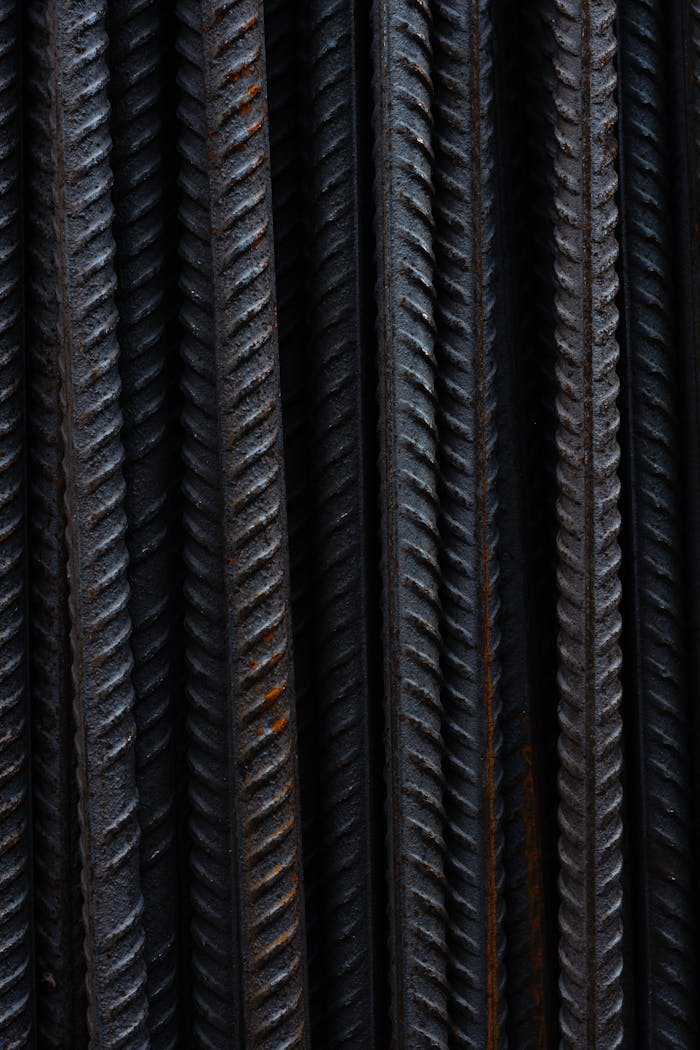 Detailed vertical shot of rusted steel rods, showing texture and industrial feel.